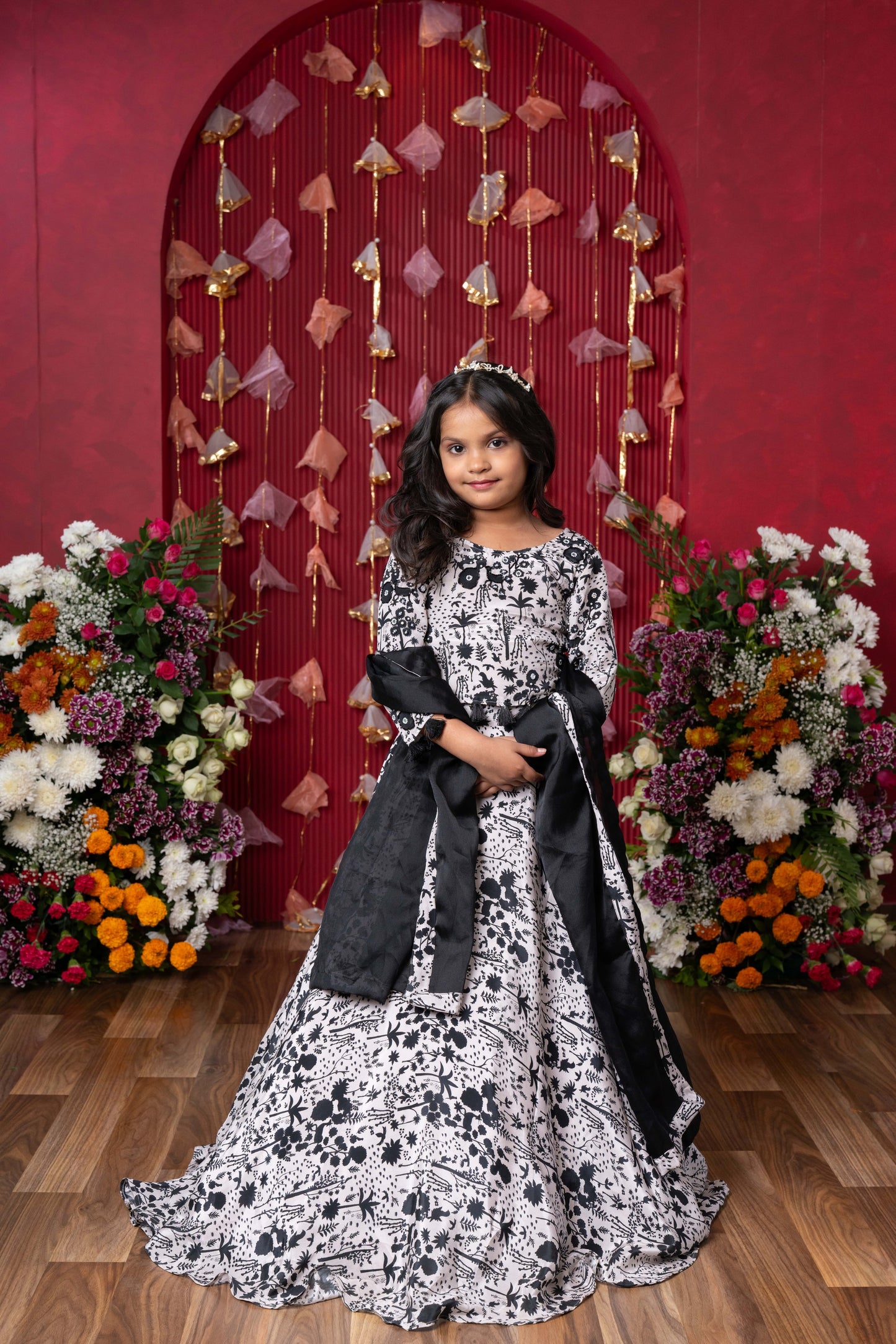 Elegant black-and-white floral lehenga set with crop top and dupatta – ideal for celebrations