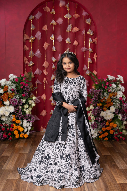 Elegant black-and-white floral lehenga set with crop top and dupatta – ideal for celebrations
