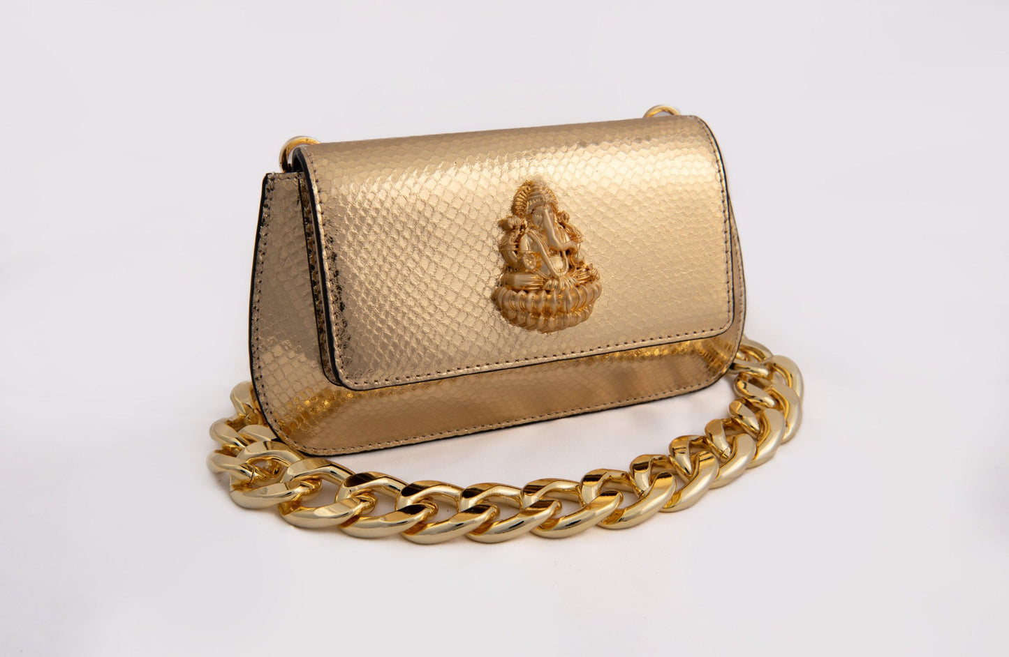 Radiant Gold Haridra Ganpati Carved Clutch