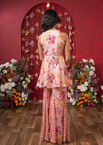 Floral Elegance: A chic peplum set with matching potli for festive charm