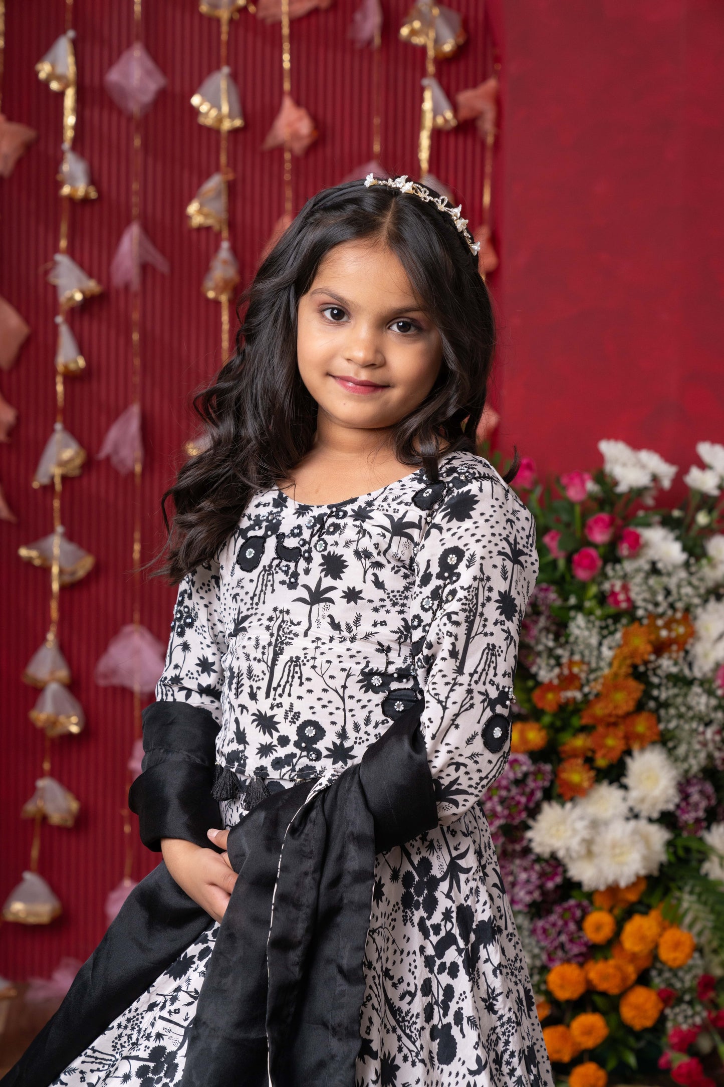 Elegant black-and-white floral lehenga set with crop top and dupatta – ideal for celebrations