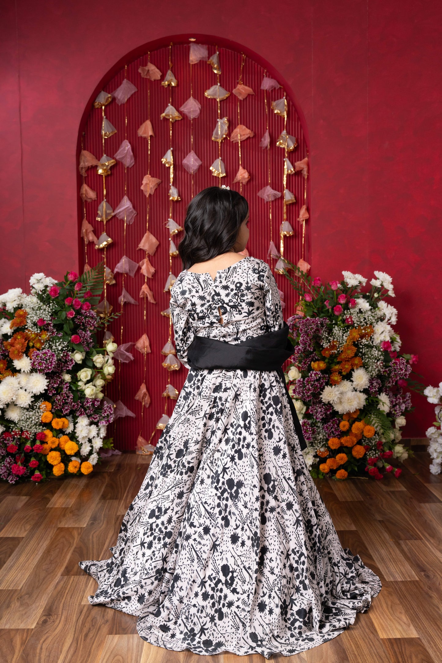 Elegant black-and-white floral lehenga set with crop top and dupatta – ideal for celebrations